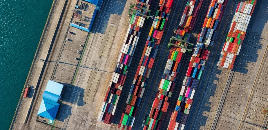 Container ship transporting cargo across international waters as part of a global sourcing and supply chain network.