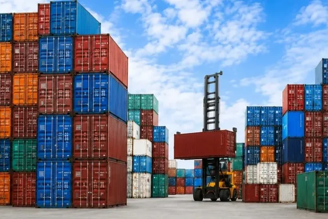 Container ship transporting cargo across international waters as part of a global sourcing and supply chain network.